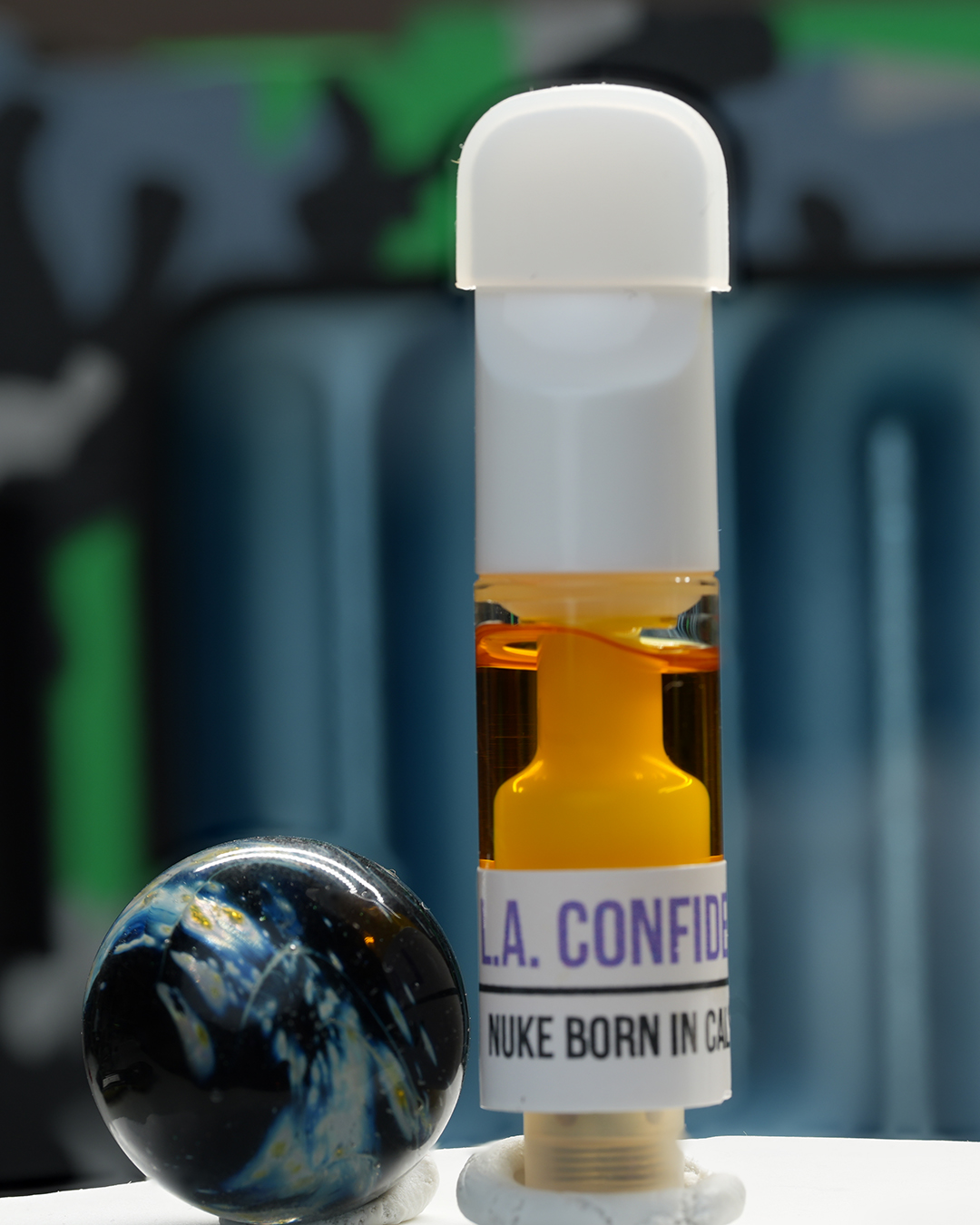 1080mg LA Confidential Nuke Cartridge with Afghani and California Indica lineage, earthy pine, kush gas, and sedating effects