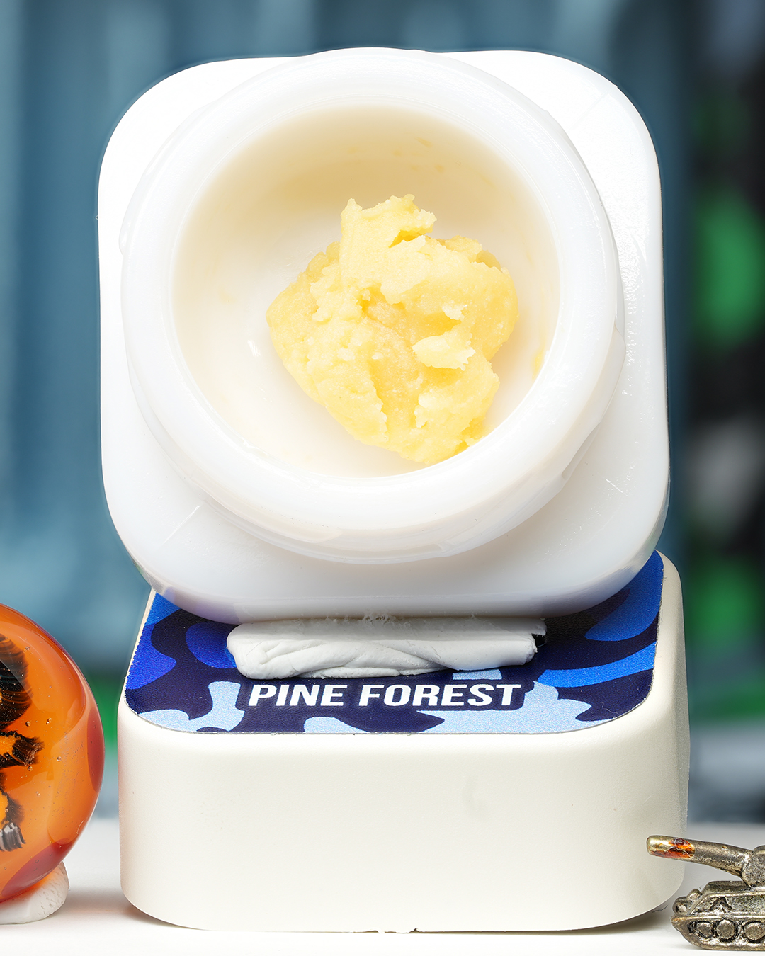 Pine Forest BHO caviar jar with pale golden textured concentrate in Dank Tank studio photography