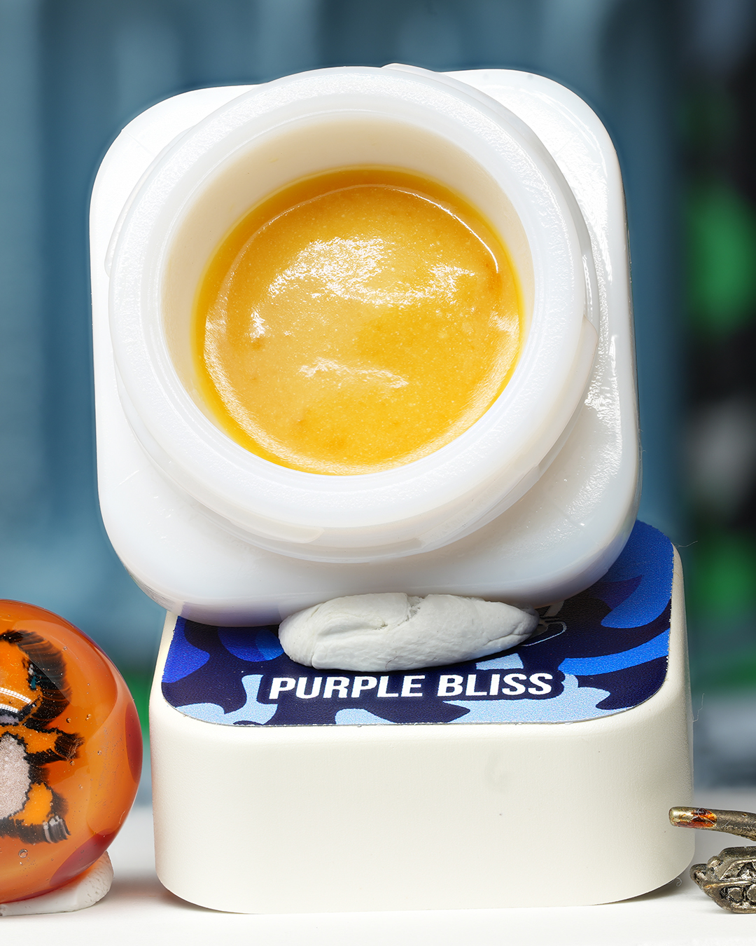 Purple Bliss BHO caviar jar with smooth golden concentrate in Dank Tank studio photography