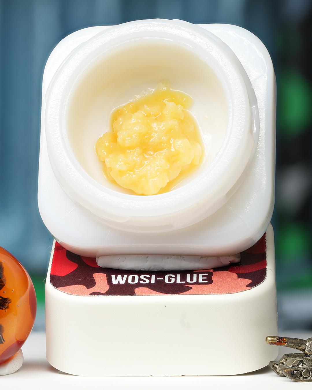 Wosi Glue BHO caviar jar with pale golden creamy concentrate in Dank Tank studio photography