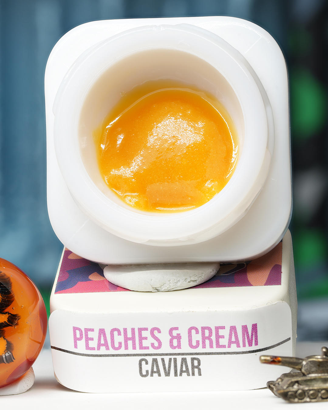 Peaches and Cream BHO caviar jar with smooth golden concentrate in Dank Tank studio photography