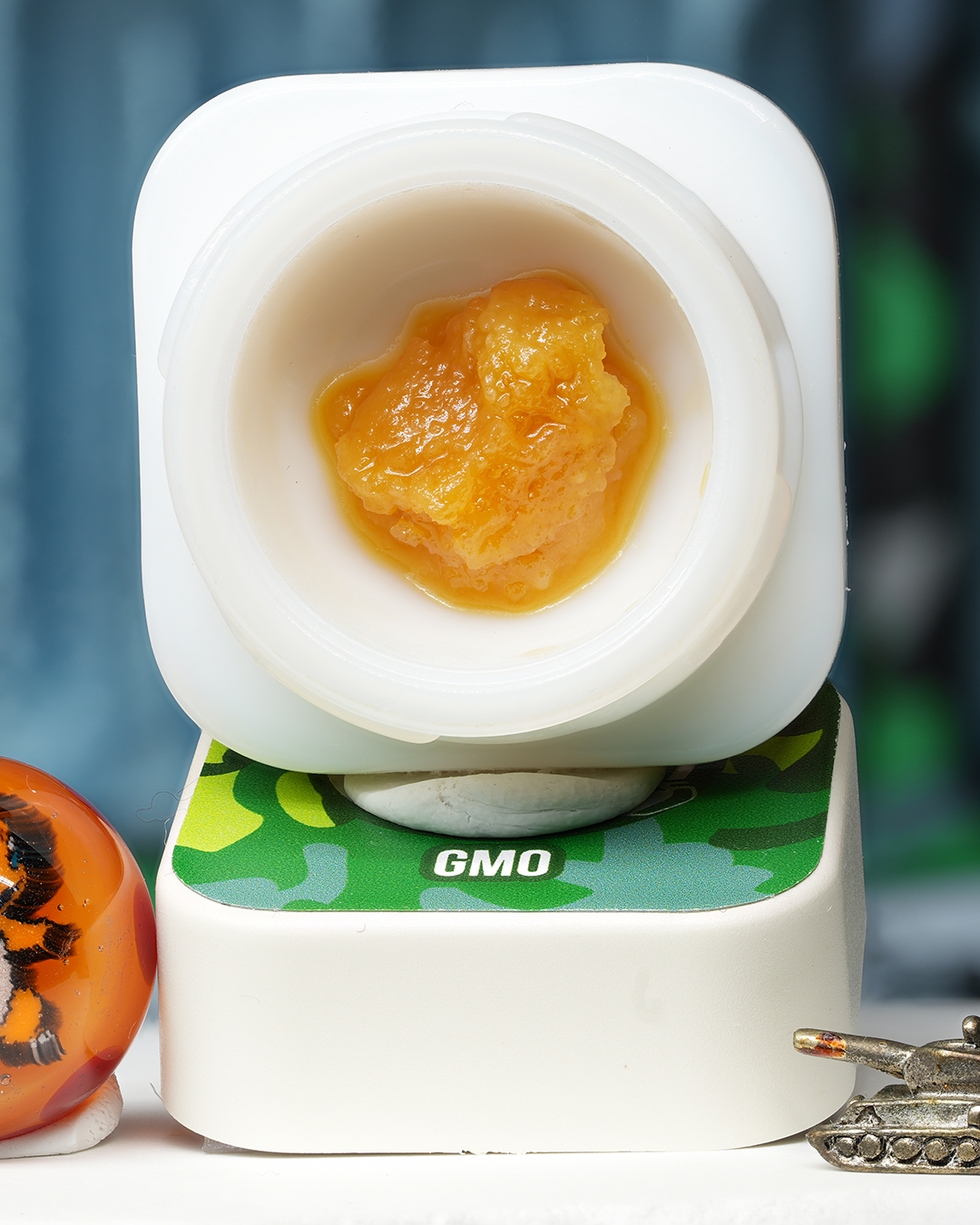 GMO BHO caviar jar with rich golden concentrate in Dank Tank studio photography