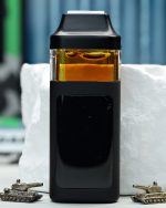 2000mg Apple Fritter Nuke All-in-One vape with Apples and Bananas and Melted Strawberry lineage, fruit pastry flavor, and daytime effects