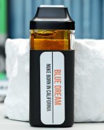 2000mg Blue Dream Nuke All-in-One vape with sweet blueberry, floral haze, citrus zest, fresh pine, and daytime effects