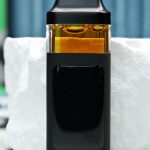 2000mg GMO Nuke All-in-One vape with savory garlic gas, funky diesel, earthy spice, heavy kush, and sedating effects