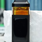 2000mg God's Grape Juice Nuke All-in-One vape with Modified Grapes and Zkittlez lineage, grape candy flavor, soft gas, and mellowing effects