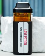 2000mg Love Potion Nuke All-in-One vape with sweet citrus, berry haze, gassy diesel, and energizing effects