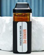 2000mg Mango Pie Nuke All-in-One vape with Mango Kush and Ultraviolet lineage, ripe mango, tropical gas, citrus sweetness, and daytime effects
