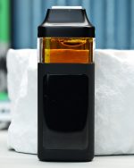 2000mg Mango Pie Nuke All-in-One vape with Mango Kush and Ultraviolet lineage, ripe mango, tropical gas, citrus sweetness, and daytime effects