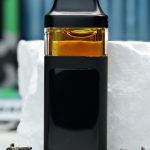 2000mg Super Silver Haze Nuke All-in-One vape with citrus haze, pine, herbal gas, Dank Tank Army legacy, and energizing effects