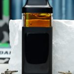 2000mg Zkittlez Nuke All-in-One vape with tropical fruit, berry candy, citrus zest, creamy grape, and mellowing effects